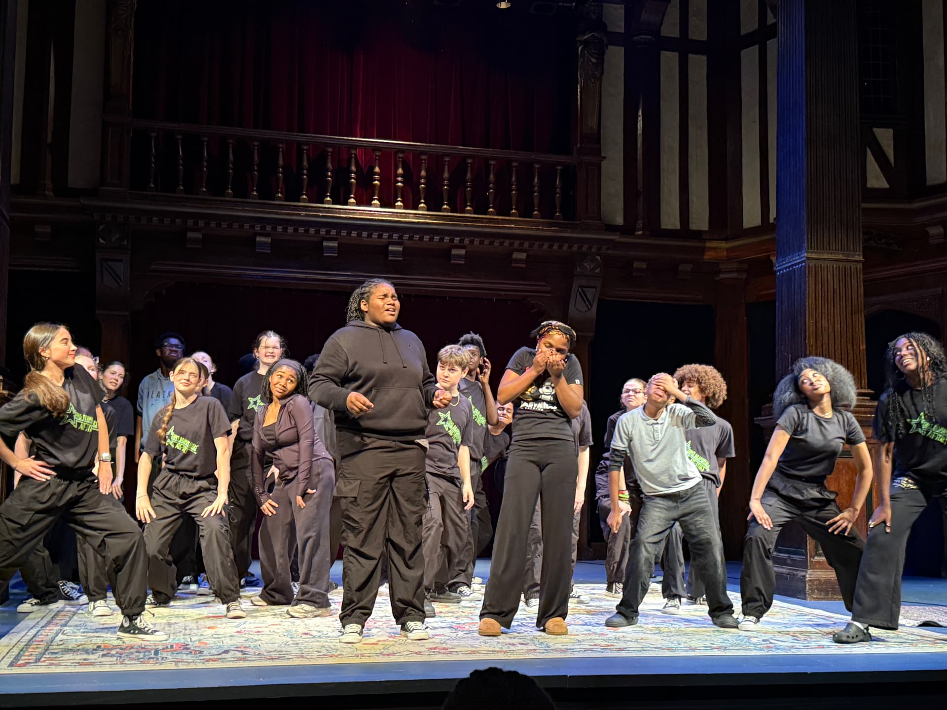 The full ensemble mid-number on stage, Asherah among them